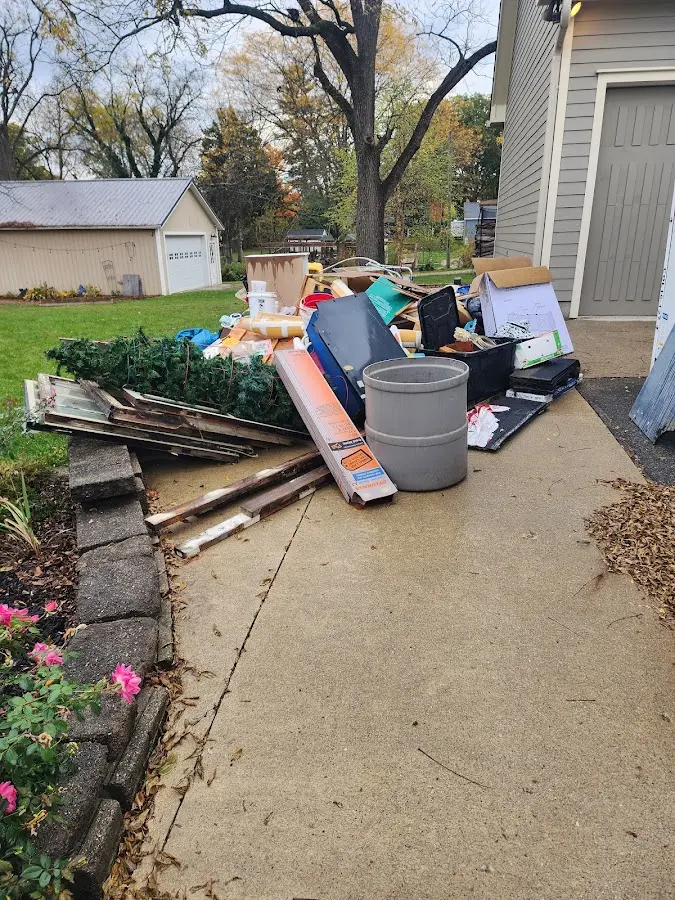 Dumpster being loaded with debris for Demolition Dumpster Rental in Athens
